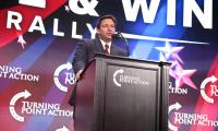 Ron DeSantis speaking at a podium