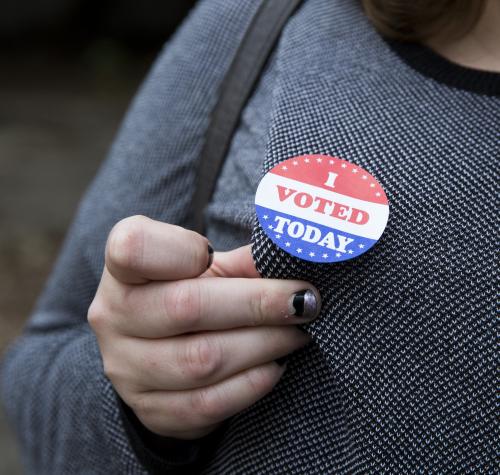 CLC client Amy Campbell shows off her voting button